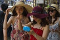 Three young Chinese women were dabting the direction of their trip