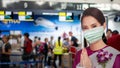 PATTAYA, THAILAND - FEBRUARY 4, 2020: air hostess welcome standee wearing protect mask at check-in area, U-Tapao International