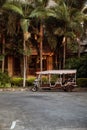 Pattaya, Thailand - March 22, 2016: Hotel tuk-tuk car driver waiting for passenger tourists. Thai three wheeled auto rikshaw