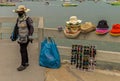 A Thai woman was selling colorful hats and sun glasses to tourists. Royalty Free Stock Photo