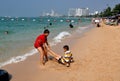 Pattaya, Thailand: Two Boys Playing on Beach Royalty Free Stock Photo