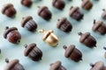 Pattern of acorns on natural green background with one golden acorn in the middle