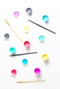 pattern of acrylic paint in cans and brushes. view from above, vertical frame Royalty Free Stock Photo