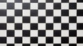 A pattern of alternating black and white square tiles, displaying a simple and classic checkered design Royalty Free Stock Photo