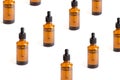 Pattern of Amber Bottles with dropper on white background