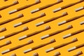 Pattern: bamboo toothbrushes on yellow background