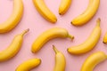 Pattern with bananas, top view, flat lay. Tropical abstract background. Banana on yellow background. Colorful fruit pattern, Royalty Free Stock Photo