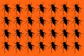 A pattern of black bugs on an orange background. Royalty Free Stock Photo