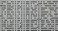 A pattern of black dots arranged in rows and columns on a light gray background, Royalty Free Stock Photo