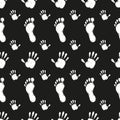 Pattern black prints of palms and feet on a black background