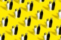 Pattern of black and white, reusable thermo bottles on yellow background.