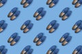 Pattern of blue suede man`s mocassin shoes over blue background