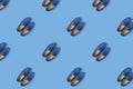 Pattern of blue suede man`s mocassin shoes over blue background