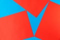 A pattern of bright red and blue pieces of paper, with clear angles and geometry, form a check mark Royalty Free Stock Photo