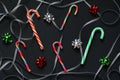 Pattern of candy cane christmas, swirls of silver ribbon and bows for gifts green, red and silver colors. Christmas decorations Royalty Free Stock Photo