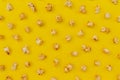 Pattern of caramel popcorn on yellow, sweet snacks Royalty Free Stock Photo