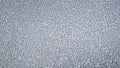 Pattern of chaotically arranged drops of water of rain or dew on the metal front hood of a bluish gray car. Royalty Free Stock Photo