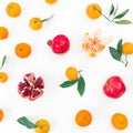 Pattern of citrus and garnet fruits on white background. Flat lay. Top view