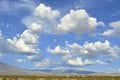 Pattern of clouds over hills and mountain range in the Mojave Desert Royalty Free Stock Photo