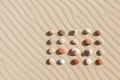 Pattern of colored pebbles on clean sand. Zen background, harmony and meditation concept Royalty Free Stock Photo