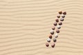 Pattern of colored pebbles on clean sand. Zen background, harmony and meditation concept Royalty Free Stock Photo