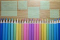 Pattern of colored pencils placed in a straight row with pencil tips on a close-up wooden table background, Colored pencils, Copy Royalty Free Stock Photo