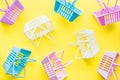 Pattern of colourful plastic shopping baskets on yellow background Royalty Free Stock Photo