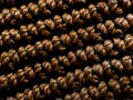 Close-up of a textured knitted bag surface made from brown yarn. Royalty Free Stock Photo