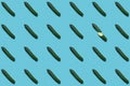 a pattern of cucumbers on a blue background.