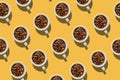 Pattern. Cup with coffee beans concept. Group of white cups on y Royalty Free Stock Photo