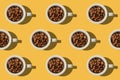 Pattern. Cup with coffee beans concept. Group of white cups on y Royalty Free Stock Photo