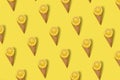 Pattern Cut Lemon with ice cream cone on bright illuminating yellow background