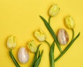 Pattern from decorative Easter eggs made from natural gemstone onyx and spring flowers of tulip Royalty Free Stock Photo