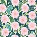 Pattern of decortive gerbera flowers and tropical leaves on dark green background