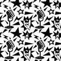 A pattern with elements of punk rock music, seamless on a white background. Black design elements, fingers, hands, star Royalty Free Stock Photo