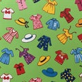Pattern featuring various clothing items and hats on a green background. Garments Royalty Free Stock Photo