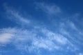 Pattern of feint white wispy clouds in blue sky Royalty Free Stock Photo