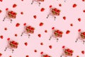 Pattern of fresh strawberry in shopping cart on pink background. Online shopping, Valentines Day minimalistic concept.