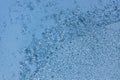 Pattern or pattern of frost and snowflakes on frozen glass of window. Christmas back. Macrophotography. Royalty Free Stock Photo