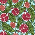 Pattern of fruits pomegranate and fig on the color of leaves. On a blue background. Royalty Free Stock Photo