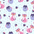 A pattern of funny cats and balls of yarn on a blue background. For use in printing, postcards, textiles. Vector Royalty Free Stock Photo