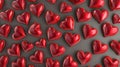 Pattern of glittering red volumetric hearts on dark background. Royalty Free Stock Photo