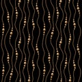 Pattern with golden balls, beads on wavy vertical golden cord. Royalty Free Stock Photo