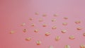 Pattern of grains of oats on a pink background.