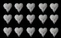 Pattern hearts of white long rice on black isolated background. Space for text. Lot hearts of white long rice. Royalty Free Stock Photo