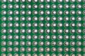 Hole pattern on a green protoboard