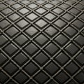 A pattern of intersecting ropes creating a diamond grid on a textured black surface. Royalty Free Stock Photo