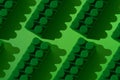 Pattern of large plastic blocks of a children`s constructor on a green background. Child development concept, logic, thinking and Royalty Free Stock Photo