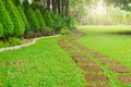 Pattern of Laterite stepping stone on a green Lawn backyard in the public park, Curve paving pattern of Laterite stepping stone on Royalty Free Stock Photo
