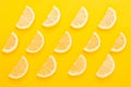 Pattern of lemon slice on yellow background. Fruit summer concept